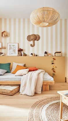 a living room filled with furniture and striped wallpaper on the walls, along with a wicker floor