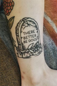 there is a tattoo on the foot of a person that has a grave in it