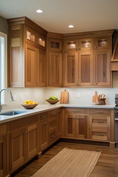 a large kitchen with wooden cabinets and white counter tops, along with a bowl of fruit on the counter