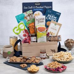 the gourmet gift box is filled with snacks and treats