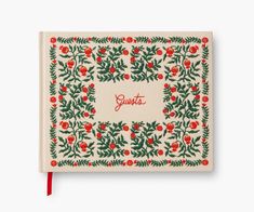 a white notebook with red flowers and green leaves on the front cover that says, sweet