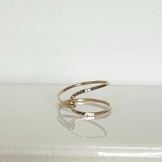 So unique, this hammered gold filled ring is perfect for every day.  I call it the "hug" ring...each is handmade and varies slightly.  You can wear it with two bands facing up or with the squeezed side up. ;) Please choose from sizes 4-10 and leave message in comment box at checkout.  Can also make in sterling! Looks great layered with the stacked gems rings...just slip inside the widest part of ring.                    ==You can view the whole ring collection== http://www.etsy.com/shop/Bellatri Gems Rings, Hug Ring, The Hug, Ring Collection, Gem Ring, Gold Filled Ring, Hammered Gold, Ring Collections, Ring Gold