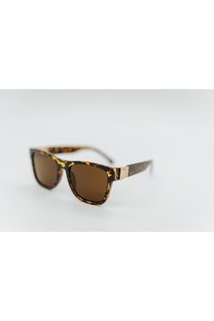 featuring the classic wayfarer shape with a modern twist, the blake is sure to be a regular in your sunglasses rotation! little details, like bronze metal accents and a subtle dip in the top of the frame, make a big impact. Wayfarer Sunglasses, Brown Leopard, Bronze Metal, Metal Accents, Metallic Accents, Dip, Twist, Sunglasses, Frame