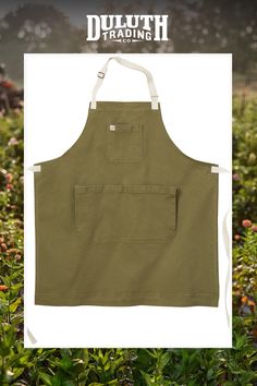 an apron that is in the middle of some plants and grass with text overlaying it