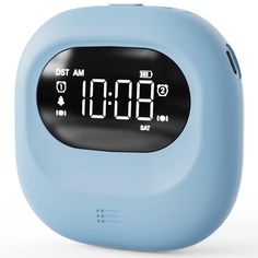 a blue alarm clock sitting on top of a table