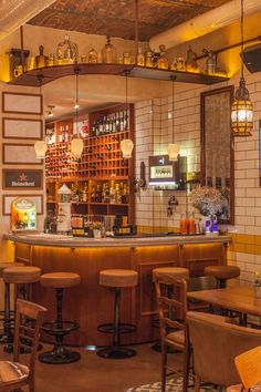 a bar with several stools in front of it