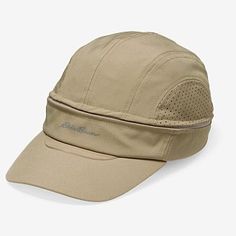 the hat is beige and has mesh detailing on the front, along with an adjustable visor