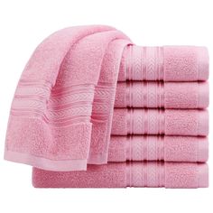 six pink towels stacked on top of each other