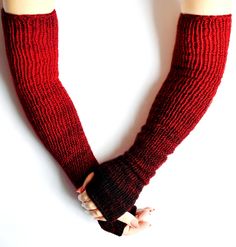 Slightly variegated in red tones, warm and soft women's arm warmers hand knitted from high quality wool - acrylic yarns. With nicely knitted edge facings, also these warmers have no seams. Light and comfortable to wear, easy to maintain and durable. These cosy and soft arm warmers will warm you up in cold winter or autumn time. Also it's available hand knit arm warmers according to your idea or size. Fiber: wool - acrylic yarns. Care: hand wash at 30 degrees C. - lay flat to dry. SIZING: univers Winter Fitted Knitting Pattern In Yarn, Handmade Fitted Leg Warmers For Winter, Fitted Multicolor Leg Warmers For Winter, Red Fitted Leg Warmers For Winter, Fitted Red Leg Warmers For Winter, Fitted Knitted Leg Warmers For Fall, Handmade Winter Red Knitting Pattern, Handmade Red Winter Knitting Pattern, Knit Arm Warmers