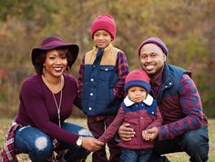 a family posing for a photo in the park