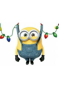 a minion hanging from a string with christmas lights