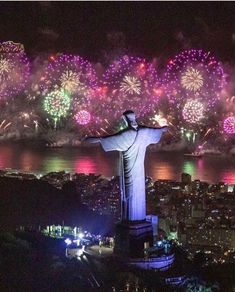 fireworks illuminate the statue of christ in rio