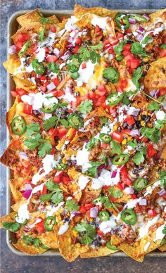 an overhead shot of nachos in a baking dish