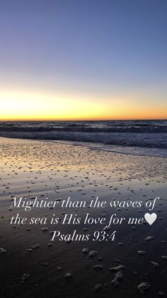 footprints in the sand with a bible verse written on it, and an ocean background