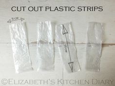 three plastic strips are taped to the side of a white wooden wall and labeled cut out