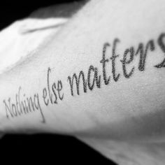 a person with a tattoo on their arm that says nothing else matters written in black ink