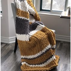 a blanket that is sitting on top of a chair