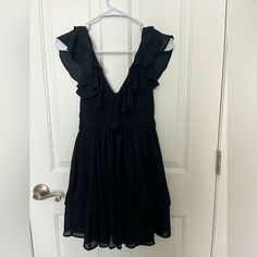 Nwot Abercrombie And Fitch Black Ruffle Mini Dress. Xsp Flowy Black Midi Dress With Ruffles, Black Flowy Knee-length Mini Dress, Black Flowy Midi Dress For Party, Black Flowy Mini Dress For Casual Wear, Black Flowy Mini Dress For Casual Events, Flowy Black Mini Dress For Casual Wear, Formal Flowy V-neck Mini Dress, Black V-neck Mini Dress Lined, Chic Black Flowy Mini Dress