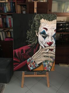 a painting of the joker on an easel