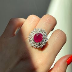 18KT White Gold Oval Ruby + Pave Diamond ring Size 8 Can be resized for an additional fee Large Statement Ring Lovely intricate design This an absolutely lovely attention getting piece! Round and Baguette Diamonds with Oval Faceted Ruby Ring. Approx 4.83 CT Ruby 10.7 x 9.9x 5.7 mm 2.20 CT Diamond Approx 9.8 grams 18KT Stamped Abrasions to the Ruby, which could be polished out by a stone cutter. We can quote for that if need b3, but this ring is so pretty, it really does not need. Check out all o Luxury Oval Ruby Diamond Ring, Exquisite Oval Ruby Ring Gia Certified, Luxury Oval Ruby Ring, Elegant Gia Certified Oval Ruby Ring, Elegant Gia Certified Halo Ring, Elegant Oval Ruby Ring With Diamonds, Luxury Oval Ruby Ring With Halo Design, Elegant Oval Ruby Ring With Vvs Clarity, Luxury Round Ruby Ring With Halo Design