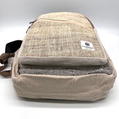 Introducing our handmade hemp backpack, a durable and eco-friendly option for carrying all your essentials. Crafted by skilled artisans, this backpack is made from high-quality hemp fiber and Heavy Duty Gheri Cotton fabric, known for its strength and durability. Not only is this backpack sturdy, but it also features a spacious interior with plenty of room for your laptop, books, and other daily necessities. The adjustable straps provide a comfortable fit, and the reinforced stitching ensures the backpack can withstand heavy use. But that's not all – our hemp backpack is also environmentally friendly. Hemp is a sustainable crop that requires minimal water and no pesticides, making it a popular choice for eco-conscious consumers. Plus, the backpack is handmade, so you can feel good knowing t Hemp Backpack Aesthetic, Eco-friendly Canvas Backpack For Everyday Use, Eco-friendly Travel Backpack, Eco-friendly Backpack With Adjustable Strap For Everyday Use, Pure Hemp Backpack, Hemp Backpack, Hemp Fiber, Daily Necessities, Pesticides