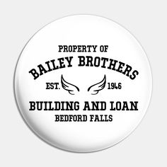 a white button with the words, property of bailey brothers building and loan bedford falls