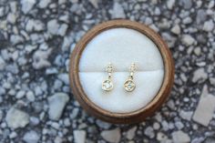 Lovely minimal 14k solid yellow gold .09 ctw diamond studs, perfect sparkly everyday look! * Handmade in the USA. * Gold KT: 14K solid yellow gold. * Primary gemstone: : 2 mm round diamond (.06 ctw). * Secondary Gemstone: 1.5 round diamond (.03 ctw). * Earring Closure: Screw Back. * Earring Style: Drop Studs. * Earring length: 11 mm approximately. * Setting Type: Prong Setting. * Additional Notes: This item can be customized. * Ready to ship. FREE SHIPPING! 14k Gold Rose Cut Diamond Earrings For Gift, Dainty Gold Diamond Earrings With Single Cut, Dainty Diamond Earrings With Single Cut Diamonds For Wedding, Dainty Diamond Earrings With Single Cut For Wedding, Dainty Everyday Diamond Earrings With Single Cut Diamonds, Dainty Everyday Diamond Earrings With Single Cut, Dainty Single Cut Diamond Earrings For Wedding, Dainty Wedding Diamond Earrings With Single Cut Diamonds, Dainty Wedding Earrings With Single Cut Diamonds