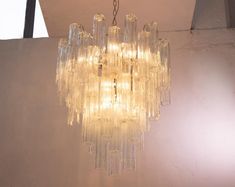 a glass chandelier hanging from the ceiling