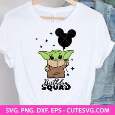 a shirt with the baby yoda holding a balloon