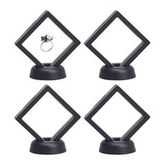 four black diamond shaped rings on top of each other in front of a white background