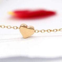 Description:Dainty Gold Tone Heart Necklace - Initial Heart Charm Necklace - Tiny Heart Pendant NecklaceThis 14k gold tone heart necklace choker is truly a gift for her to wear for a warm heart and joyful days. It is so sweet and graceful by itself but can be worn with other accessoriesSpecification:Length: 42 cm + 5 cm extWeight: 3 gMaterial: 14k gold filled metalAny type of art can be kept alive only when it can breathe on its own!Happy Shopping :-) Trendy Rose Gold Charm Necklaces For Valentine's Day, Trendy Rose Gold Heart Charm Necklaces, Trendy Rose Gold Heart Charm Necklace, Minimalist Heart Pendant Bracelet, Trendy Heart Choker Necklace For Gifts, Trendy Heart Necklace With Heart Charm For Gifting, Trendy Heart Pendant Jewelry With Heart Print, Trendy Heart Necklace With Heart Charm As Gift, Trendy Heart Charm Necklace As A Gift