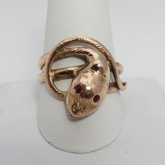 Wonderful estate 14k rose gold ruby eyes snake ring . big and a size 11.25. this ring was sized up at one time. unique beautiful estate ring 1900's. great shape. 6 grams. 19.38mm wide. marked 14k. Vintage 14k Rose Gold Rings In Gold Color, Collectible Rose Gold Jewelry With Polished Finish, Collectible Fine Jewelry In Rose Gold, Collectible 14k Rose Gold Rings, 14k Rose Gold Ring Stamped 14k, Antique Rose Gold Rings For Gift, Collectible Heirloom Rose Gold Jewelry, Antique 14k Rose Gold Rings, Antique 14k Rose Gold Jewelry