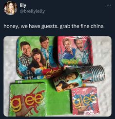 there are some snacks and drinks on the bed with one person's face in the background