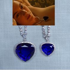 This gorgeous dramatic reproduction of The Heart of the Ocean Necklace from The Titanic movie from 1997 is available in 2 sizes and features large sapphire blue heart cut cubic zirconia. The large size measures 47x51mm (including heart atop pendant) and the small size measures 32x34mm. Both are surrounded by a halo of small round clear CZs. The necklace is made with prong set round, pear, marquise and a single trilliant cut CZs in basket settings to let in lots of light for sparkle. Can be made Luxury Sapphire Heart Necklace, Cheap Blue Heart Necklace For Valentine's Day, Blue Heart Necklace Jewelry, Cheap Blue Heart Necklace, Heart Of The Ocean Necklace Real, Heart Blue Necklace, Heart Of The Ocean Necklace, Heart Of The Ocean, Barbie Drawing