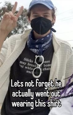 a man wearing a face mask with the words let's not forget he actually went out wearing his shirt