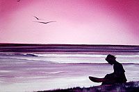 a man sitting on top of a beach next to the ocean under a pink sky