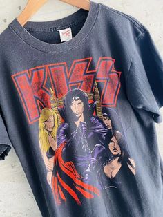 a t - shirt with an image of the band kiss on it