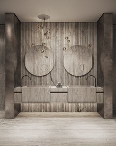 an elegant bathroom with two circular mirrors on the wall