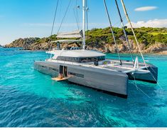 a catamaran sailing in the blue water