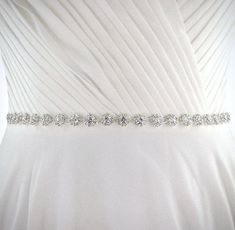 Add a touch of classic elegance to your bridal gown with this sparkling beaded belt! Adorned with an array of glowing crystals on a silver / rose gold / yellow gold base, it will give your dress an extra touch of glam to finish off your perfect look on your wedding day. This belt can be ordered two ways: 1) Crystal appliqué only (no ribbon) - 1 yard/36"/91.5cm. This style is designed to go all around the waist and can be sewn directly onto the dress. 2) Attached to double-sided satin ribbon 0.4" Bridal Accessories Belt, Hair Accessories Tiara, Flower Girl Jewelry, Pearl Bridal Jewelry, Rose Gold Bridal, Pearl Jewelry Sets, Beaded Belt, Flower Girl Gifts, Bridal Belt