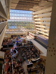 an overhead view of the inside of a building with people sitting at tables and eating