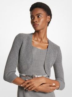 This cashmere shrug is a luxurious wardrobe staple with a textural update. Defined by a shaker-stitch finish, it’s free of fastenings or hardware for a smooth and effortless fit. Layer it over the coordinating shift dress or matching tailored separates. Formal Fitted Cashmere Cardigan, Fitted Spring Cashmere Outerwear, Fitted Cashmere Outerwear For Spring, Fitted Sweater For Formal Spring Occasion, Fitted Cashmere Sweater For Spring, Modern Fitted Cardigan For Spring, Formal Cashmere Cardigan For Spring, Fitted Shrug For Workwear In Spring, Fitted Shrug For Spring Workwear