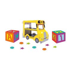 a yellow toy bus with blocks and stars around it on a white background for children's birthday party decorations