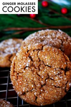 some cookies are cooling on a rack with christmas decorations in the backgroung