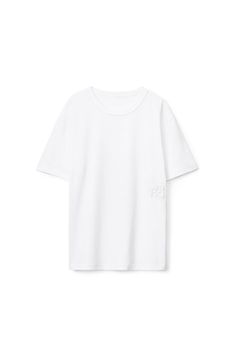 White classic short-sleeve crewneck tee in structured jersey with stacked puff paint logo at left side. Relaxed fit. Bottom hem hits below hips. Composition: 100% cotton. Made in china. Model is 5'9" and wears size s. 4CC3221357100. Relaxed Fit T-shirt With Logo And Short Sleeves, Summer T-shirt With Logo Detail And Relaxed Fit, Relaxed Fit T-shirt With Logo Detail For Summer, Paint Logo, Puff Paint, Logo Tee, Logo Tees, Alexander Wang, White Undershirt