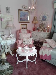 a living room filled with furniture and pink carpeted flooring in front of a window