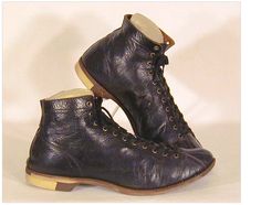 an old pair of black leather boots with laces