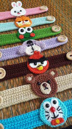 several crocheted headbands with cartoon characters on them