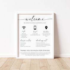 a white framed poster with the words welcome and location information in black ink on it