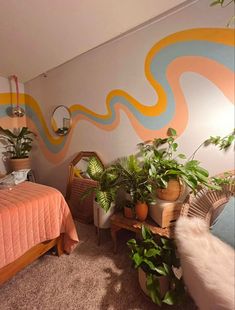 a bed room with a neatly made bed and plants